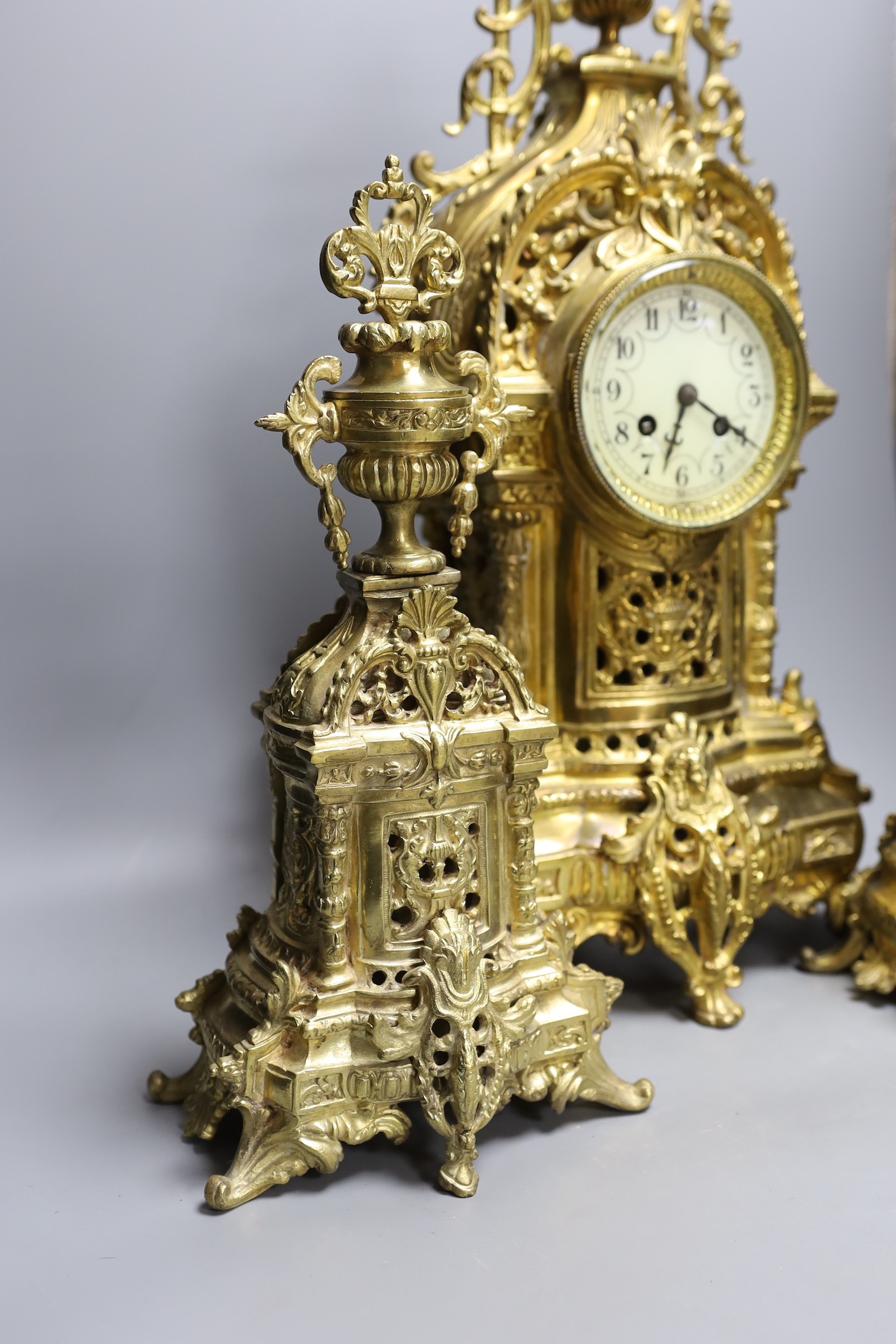 A large decorative French gilded bronze 19th century clock garniture - 56cm tall